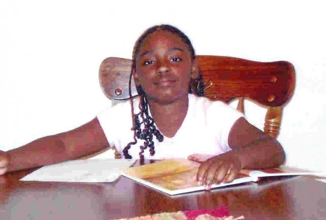 Makaela doing summer homework.