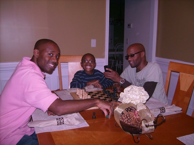Darrick, Darrick Jr and Garret enjoying a game of chess after Thanksgiving dinner in Charlotte NC