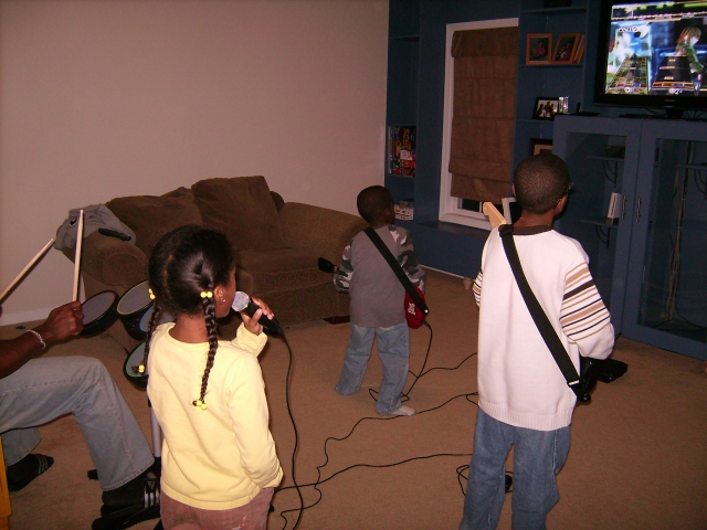 Noah, Mya, Darrick Jr and Maurice playing Rockband