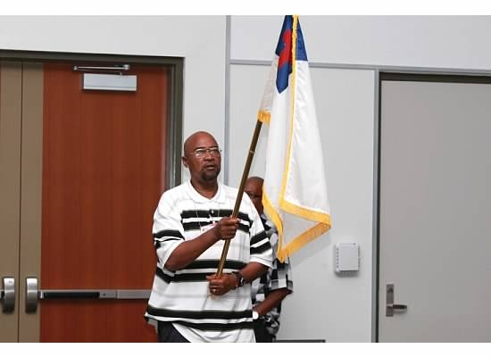 Will Gillyard carrying the Christian Flag