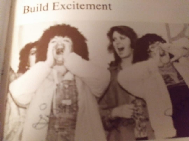 Bobbie Isbell, Lisa Davis Ysasi, Donna Barb Conley, and Laurie Ramsey-Grant cheering for the Bulldogs.