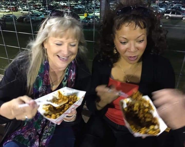Burkburnett Homecoming Game in 2018. Tiffany Alvey Herring and Marcella F. Thompson-Caldwell enjoying Frito Pie.