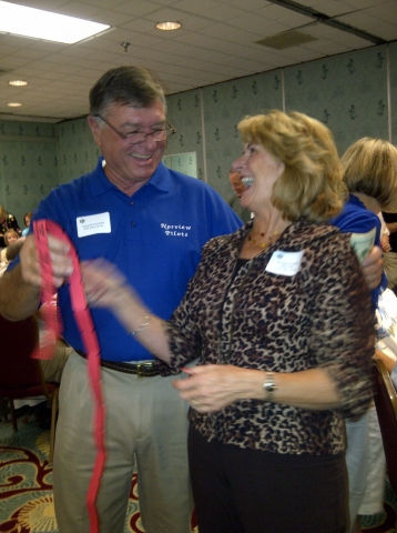 Wayne Foshay & Brenda White Holster selling raffle tickets for Scholarship fund