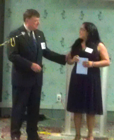 Wayne Foshay Presenting a gift to Nathalie Williams who designed our web site