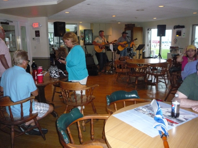 The party moved inside clubhouse when the rain came (photo courtesy Nancy LeRoy Burk)