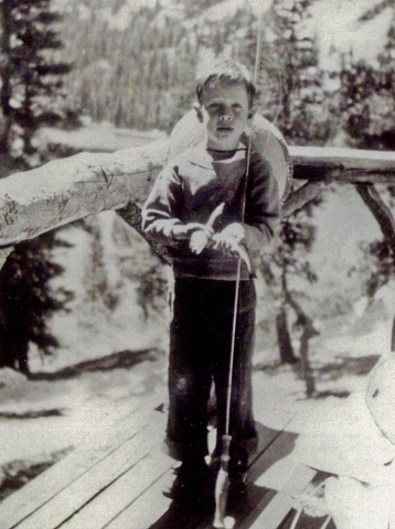 A very young little Loren poses with the first fish he ever caught. If you look REAL close, you can actually see it! Cute!