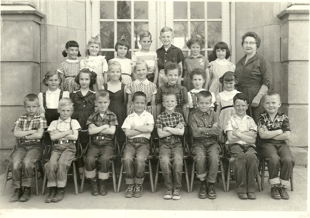Polk Elementary 1st Grade Front Row, L to R, Doug Jacobs, Ralph Pugmire, Greg ?, Doug Austin, Tim Curtis, Bradd Christensen, Paul Milligan, Dee Sessions, row two; Ann Bennion, Nancy Johnson, Karen Peterson, Terri Newman, Carol Ann ?, Diane ?, Valerie Brow