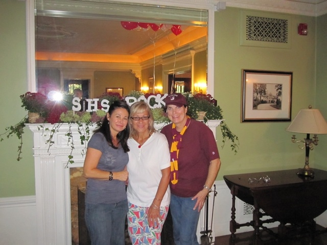 Toni, Cheryl and Mimi in front of the mantle. Wait, what does that say behind them?