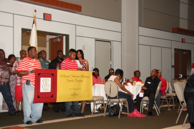 Opening Ceremonies Processional. The Family Reunion Banner